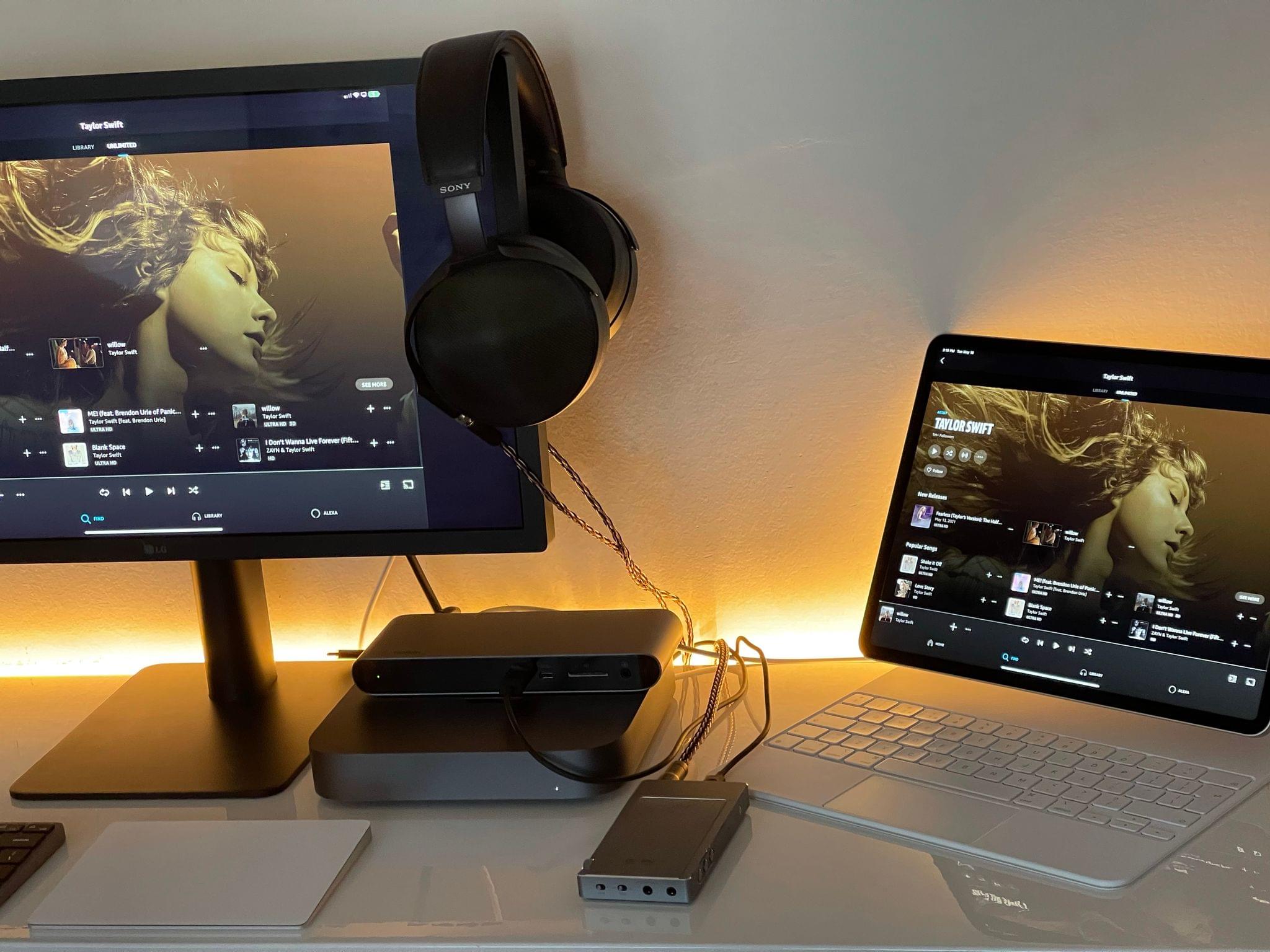 My Thunderbolt setup featuring a 2021 iPad Pro, Mac mini, Belkin dock, external USB DAC, and Sony headphones. It's a whole mess of cables, but that's what you get when you want to listen to lossless music and have a small desk. It's cozy.